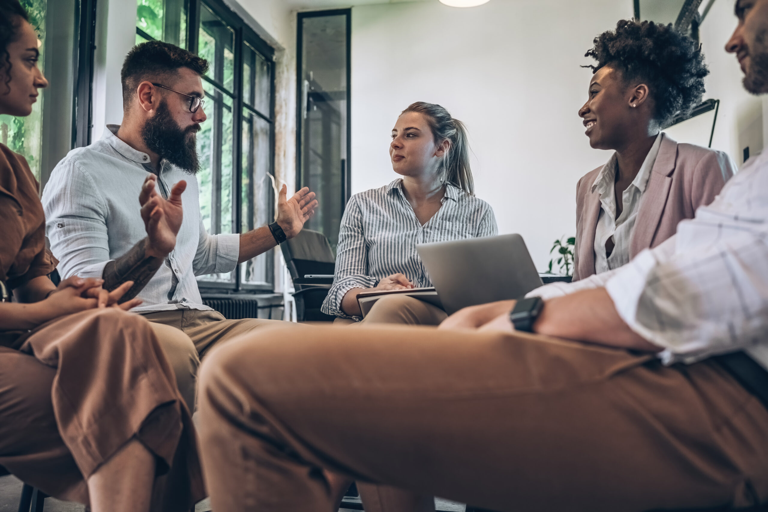 A marketing team discussing direct marketing solutions.