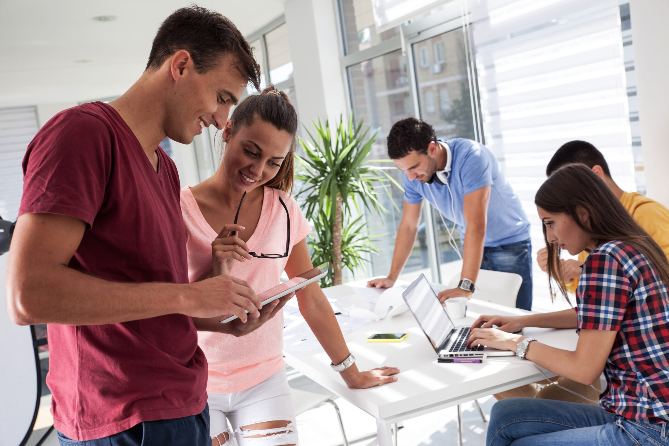 Young employees working together in sales internship.