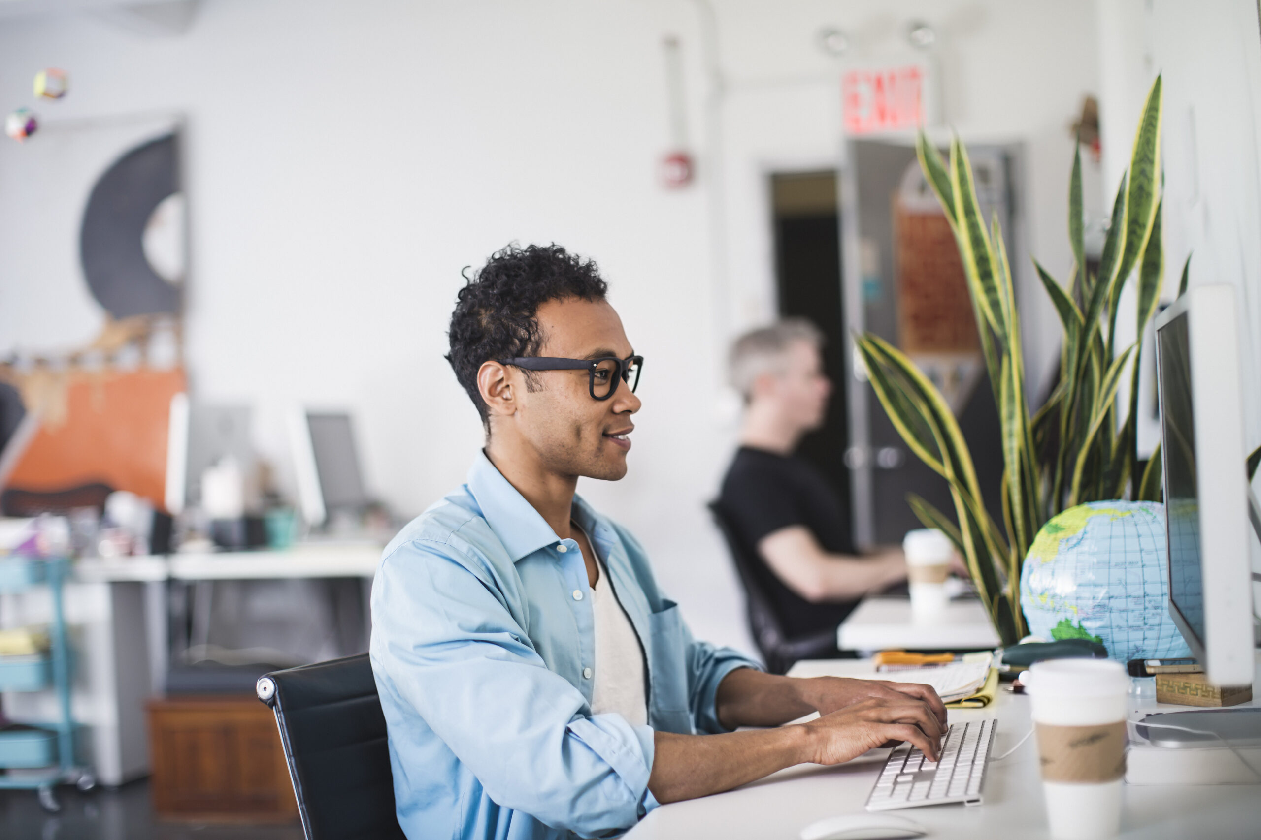 A male employee with a marketing job working inside the office.